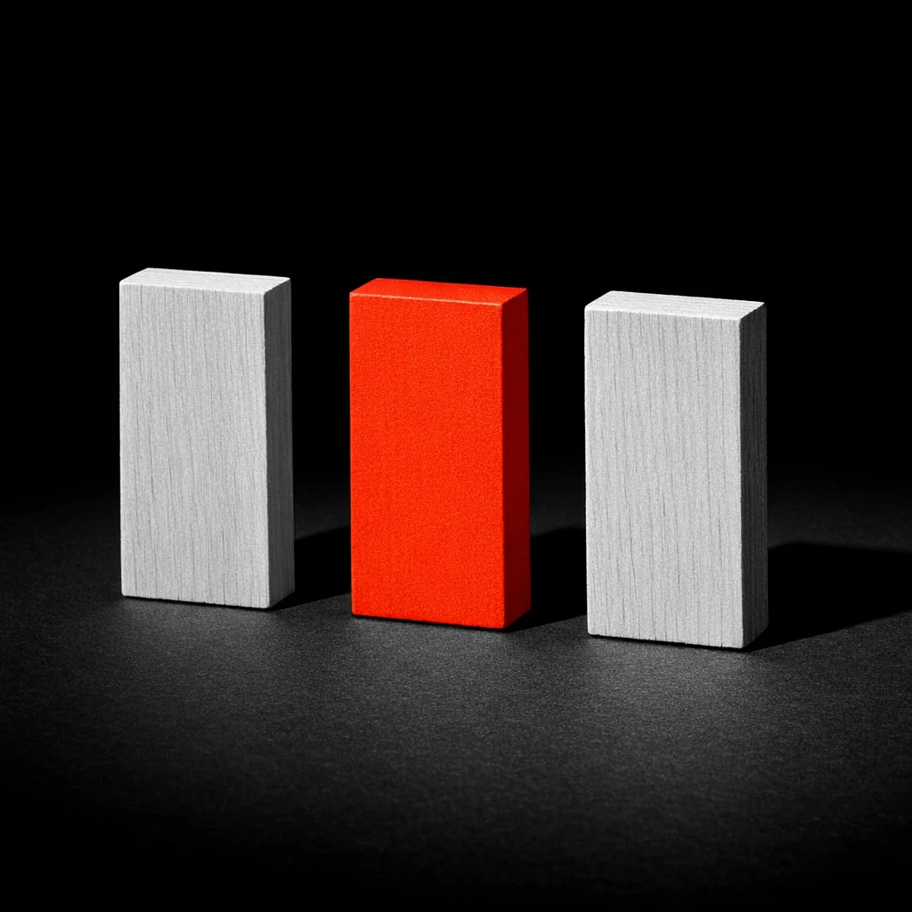 Three identical wooden dominoes standing upright with the middle one painted matte vermillion, illustrating browser, PWA and native-app tiers at non gamstop mobile casinos